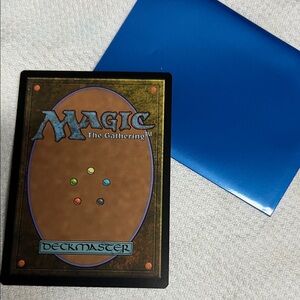 Magic: The Gathering Deckmaster Card with Blue Sleeve
